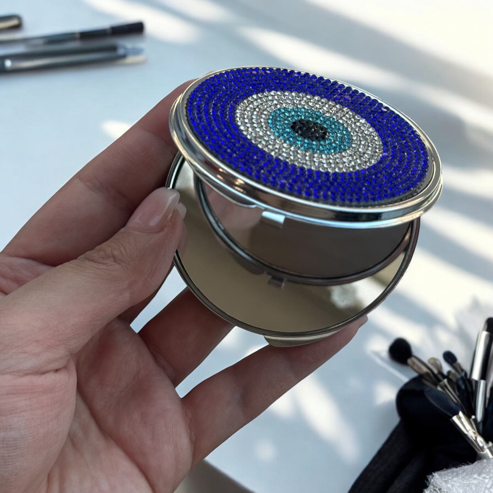 Compacte zakspiegel met Nazar oog symbool, perfect voor in je tas en stijlvolle persoonlijke verzorging