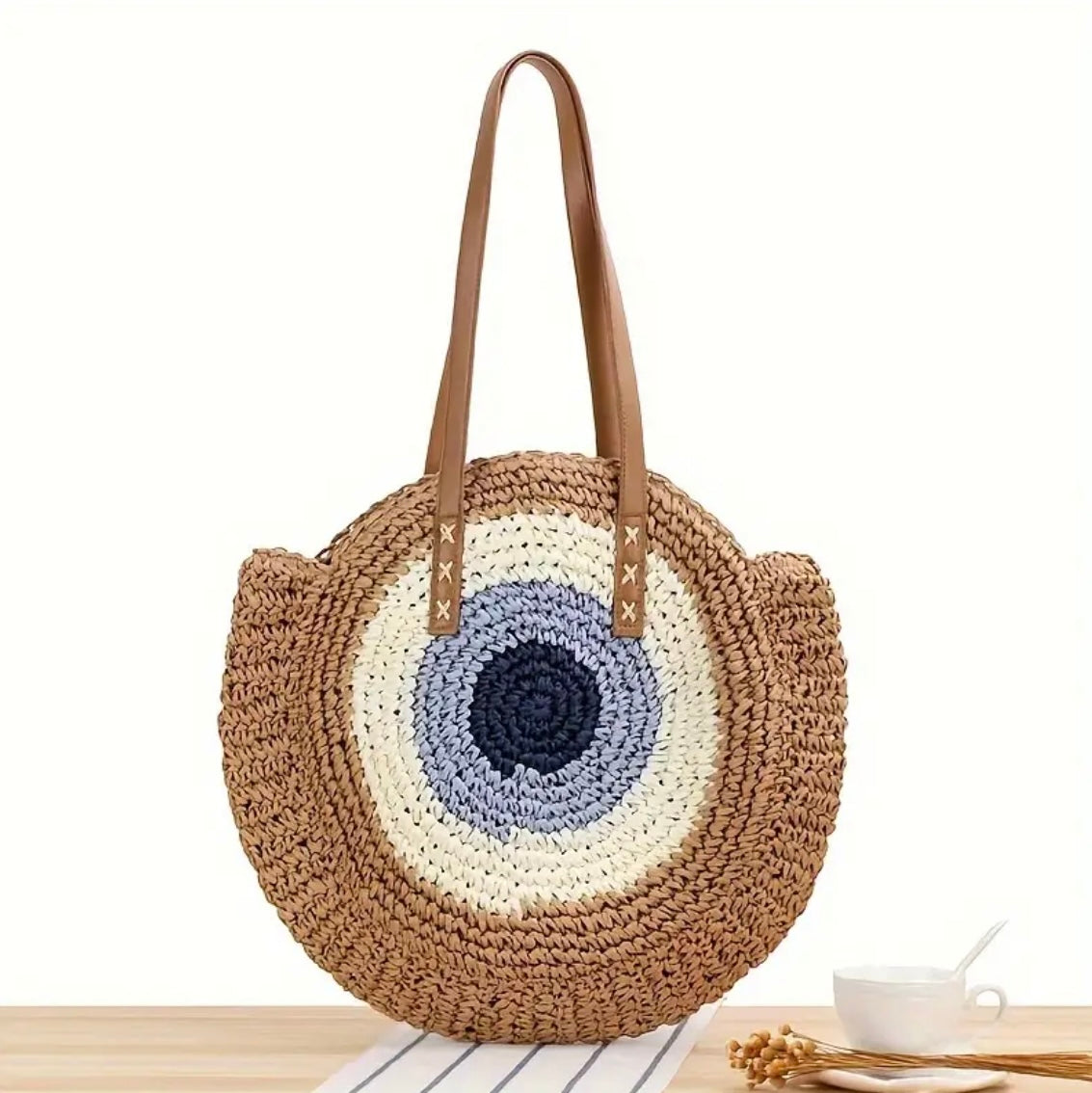 Boze Oog Stormi Schoudertas in stijlvol bruin, met afmetingen van 39x39 cm, veilige ritssluiting, ruime opbergruimte, en duurzame kwaliteit. Ideaal voor het strand of dagelijks gebruik