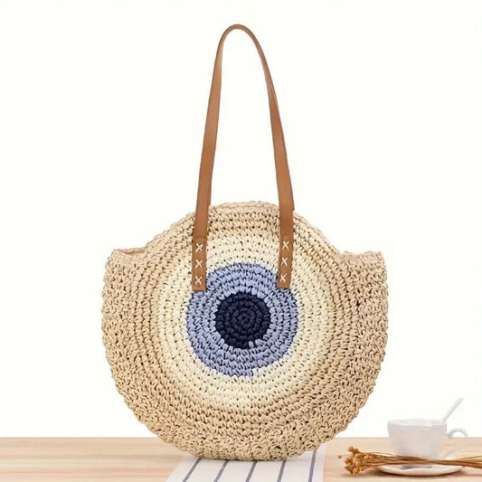 Yara Boze Oog Schoudertas in beige, 39x39 cm, met veilige ritssluiting en ruime opbergruimte. Ideaal voor het strand of dagelijks gebruik, biedt stijl en functionaliteit.