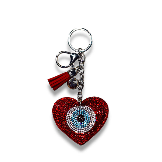 Rode boze oog Nazar sleutelhanger in hartvorm, 6,3 cm, gemaakt van duurzaam materiaal. Voorzien van het Nazar amulet voor bescherming tegen negatieve energie, een stijlvolle en functionele toevoeging aan je sleutelbos.