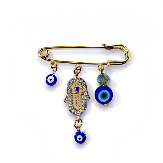Elegante broche van 5 cm met Hamsa Hand en Boze Oog symbool, gouden afwerking, gemaakt van hoogwaardig metaal. Biedt bescherming en stijl, perfect als accessoire of cadeau.