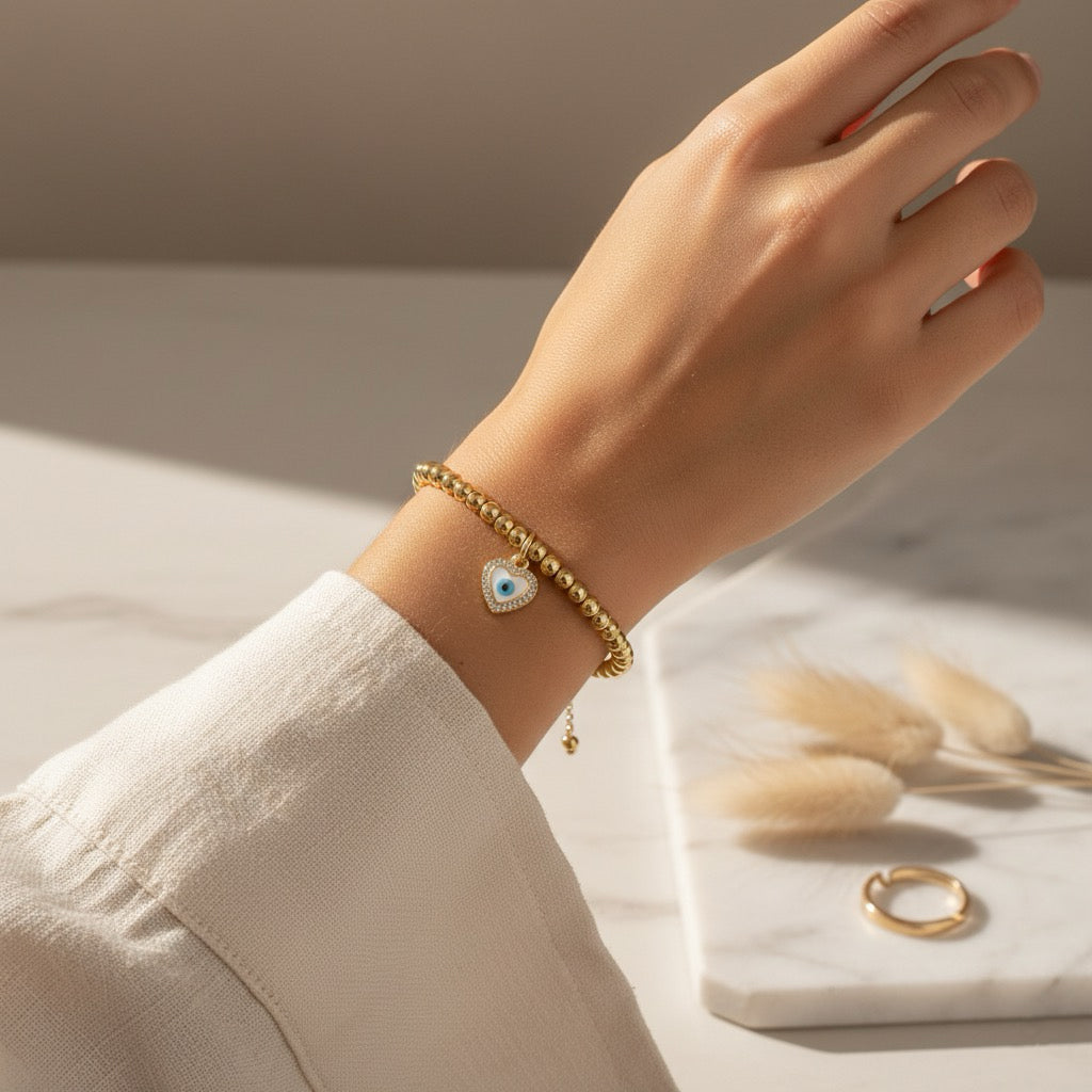 Gouden stainless steel armband met Nazar hart hanger – Armband Ayla