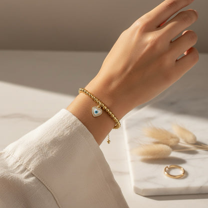 Gouden stainless steel armband met Nazar hart hanger – Armband Ayla